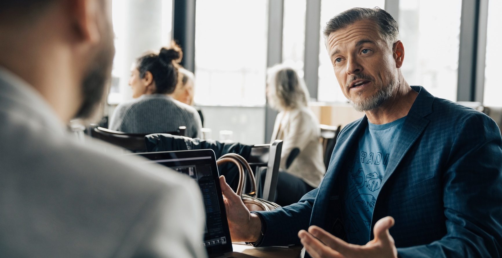 Businessman Talking To Colleague